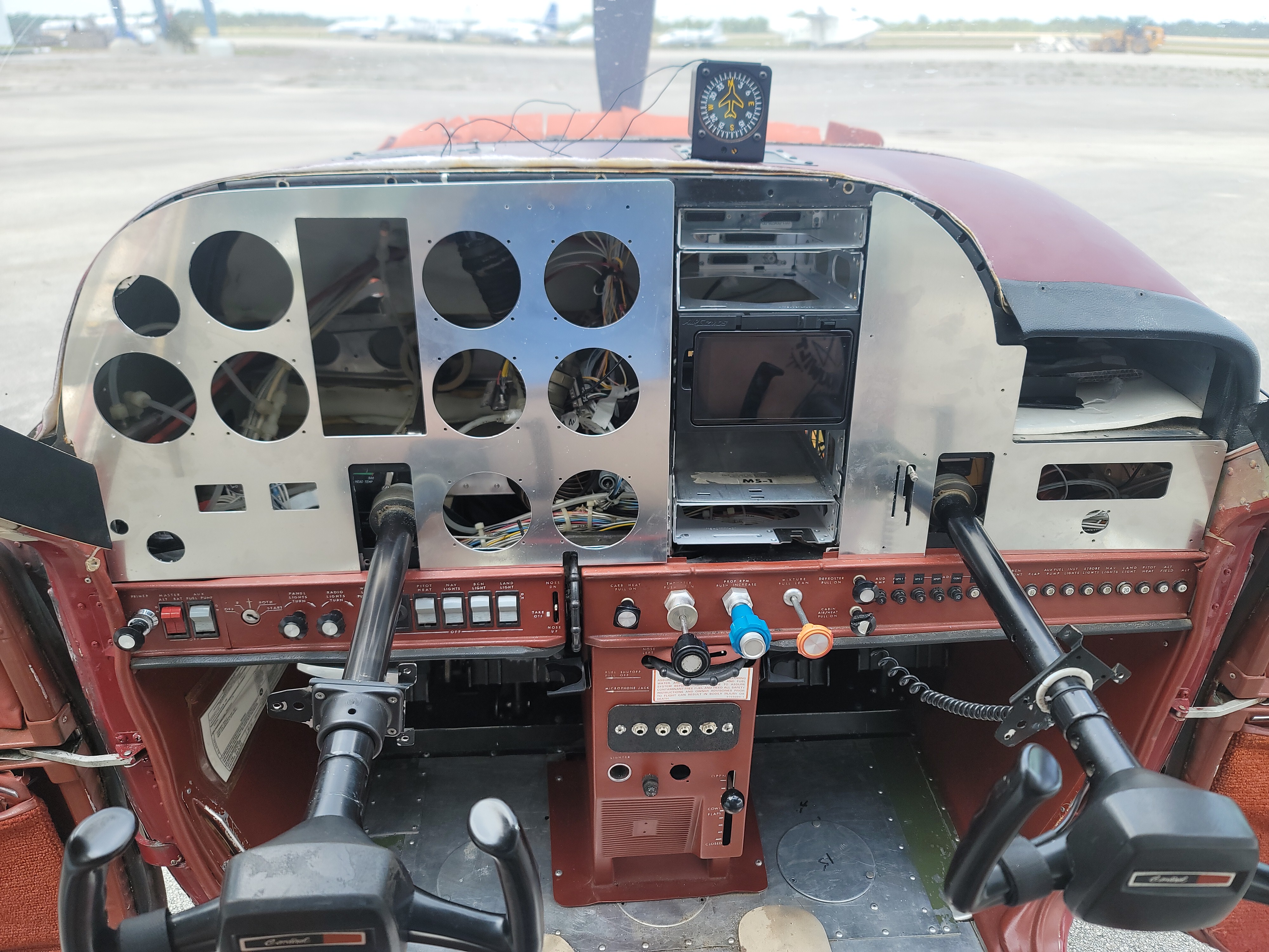 airplane undergoing repairs with parts exposed