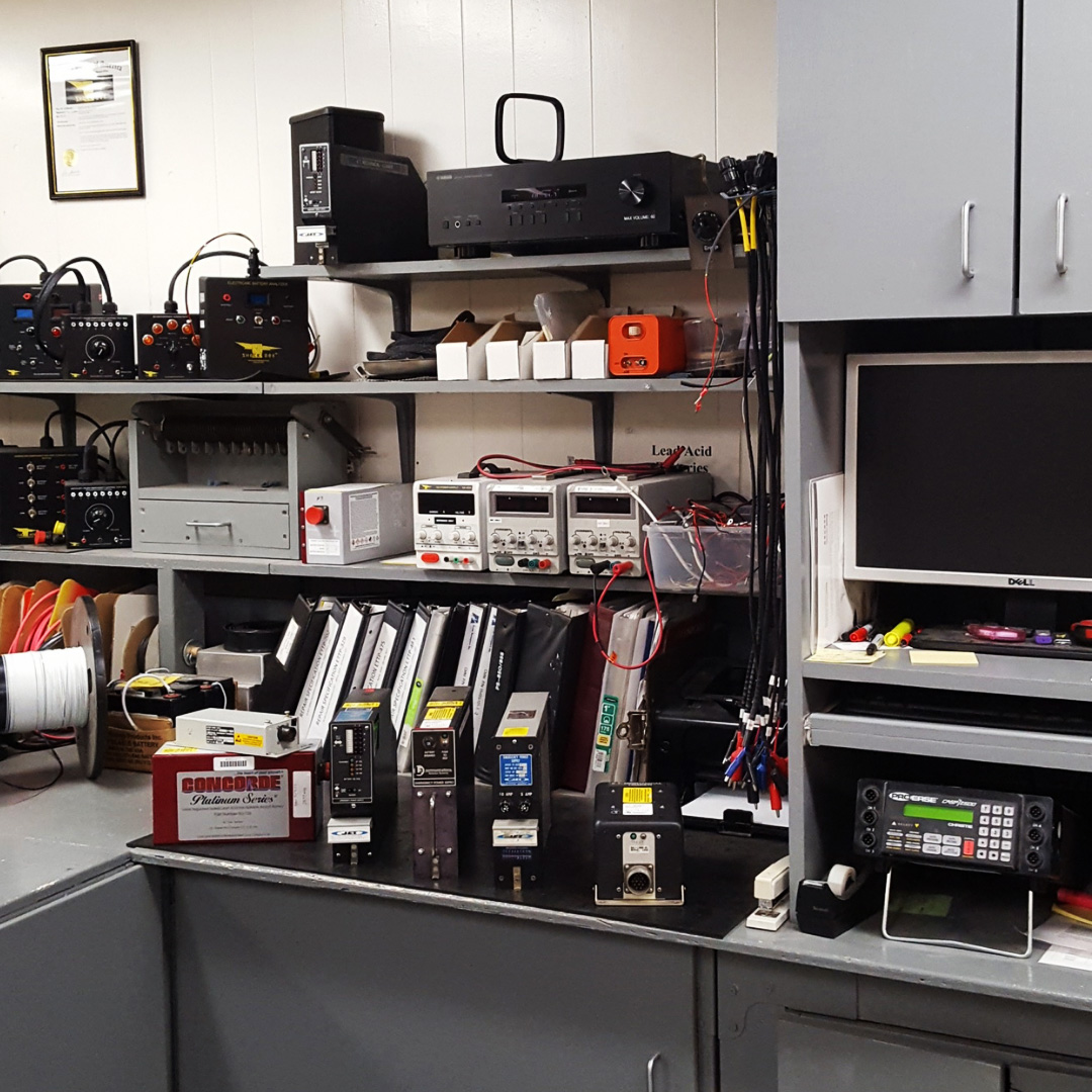 Image of servicing EPS, lead-acid, and Ni-Cad batteries in an aircraft.