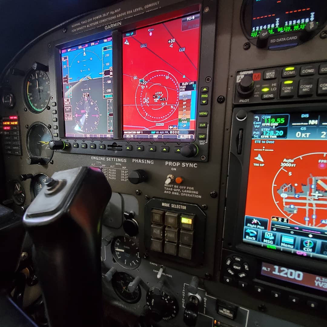 Image of technicians installing new avionics equipment in an aircraft.